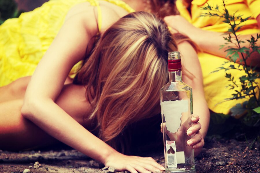 Teen alcohol addiction (drunk teens with vodka bottle)
