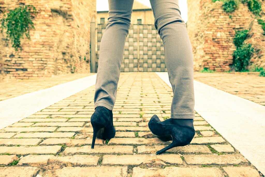 Woman Walking On High Heeled Shoes - Closeup Of Young Girl Legs