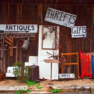 View of antiques thrift store with various items displayed.