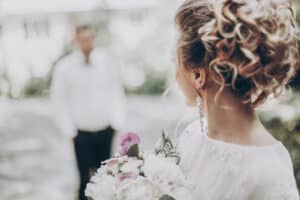 stylish wedding bride with bouquet and amazing modern dress